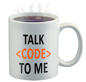 Coffee mug with words Talk Code to Me written on the side