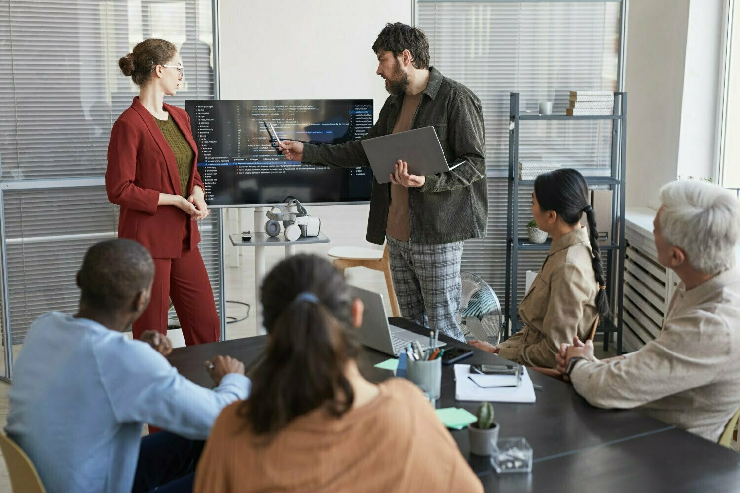 BSPOKE Software - Bespoke Software Outsourcing a team of developers disucussing a software prject