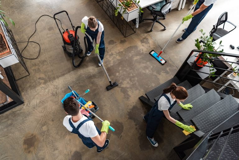 BSPOKE Software - Employees cleaning an office who had bespoke software developed by a software company