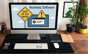 Computer monitor on desk, showing software that has reached the end of the road, representing why you need to update old software.