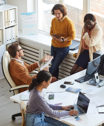 Group of software developers in an office to represent discussing acceptance criteria for a custom software project.