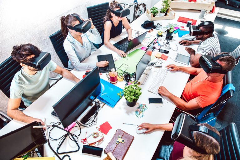 Group of office workers using VR headset representing digital innovation.