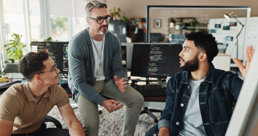 Photo of a group of software developers, representing outsource software for your custom software project.