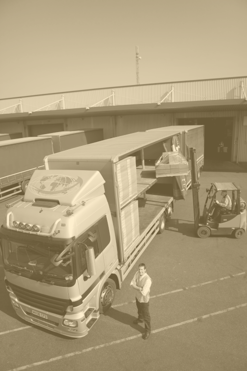 Photo of a orange tinted saturated lorry and driver.